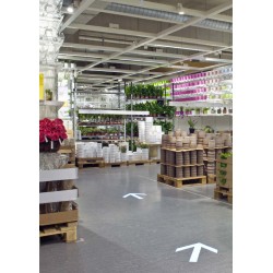 Projection de flèche lumineuse au sol pour orienter les clients/visiteurs dans l'espace de vente